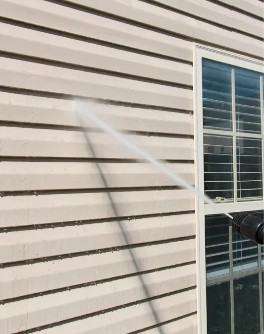 Vinyl siding being washed on a Wesley Chapel home